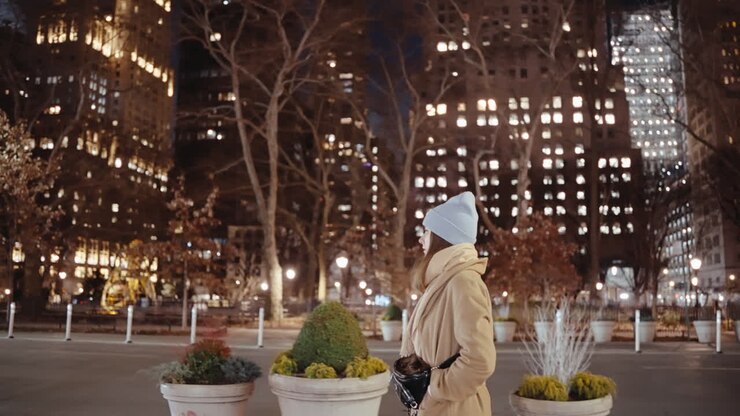 Woman Walking at Night in New York City