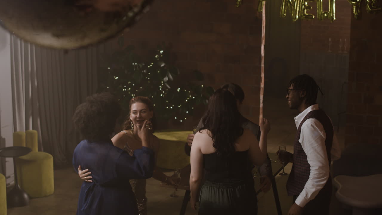 Friends celebrating New Year's Eve at a party