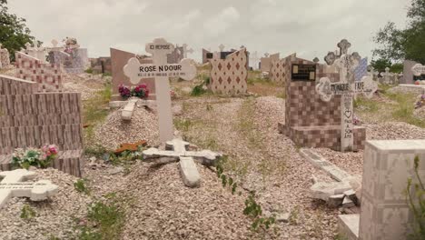 A-truck-shot-of-the-graves-and-tombstones-in-the-Fadiouth-cemetery,-Senegal