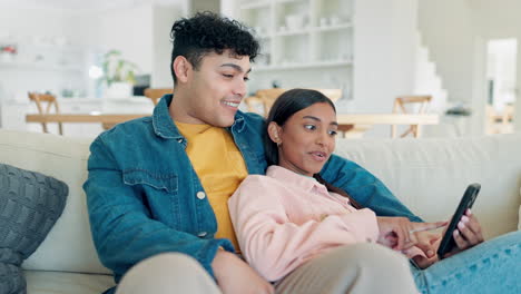 Smartphone,-smile-and-couple-talking-in-home