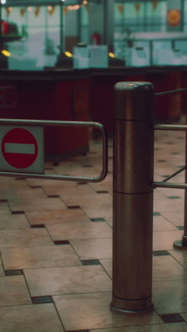 empty supermarket checkout with barrier