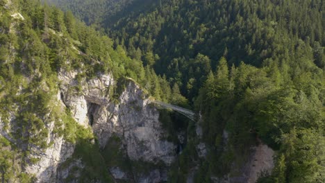 aerial establishing shot, mary's bridge at neuschwanstein castle in bavaria, germany