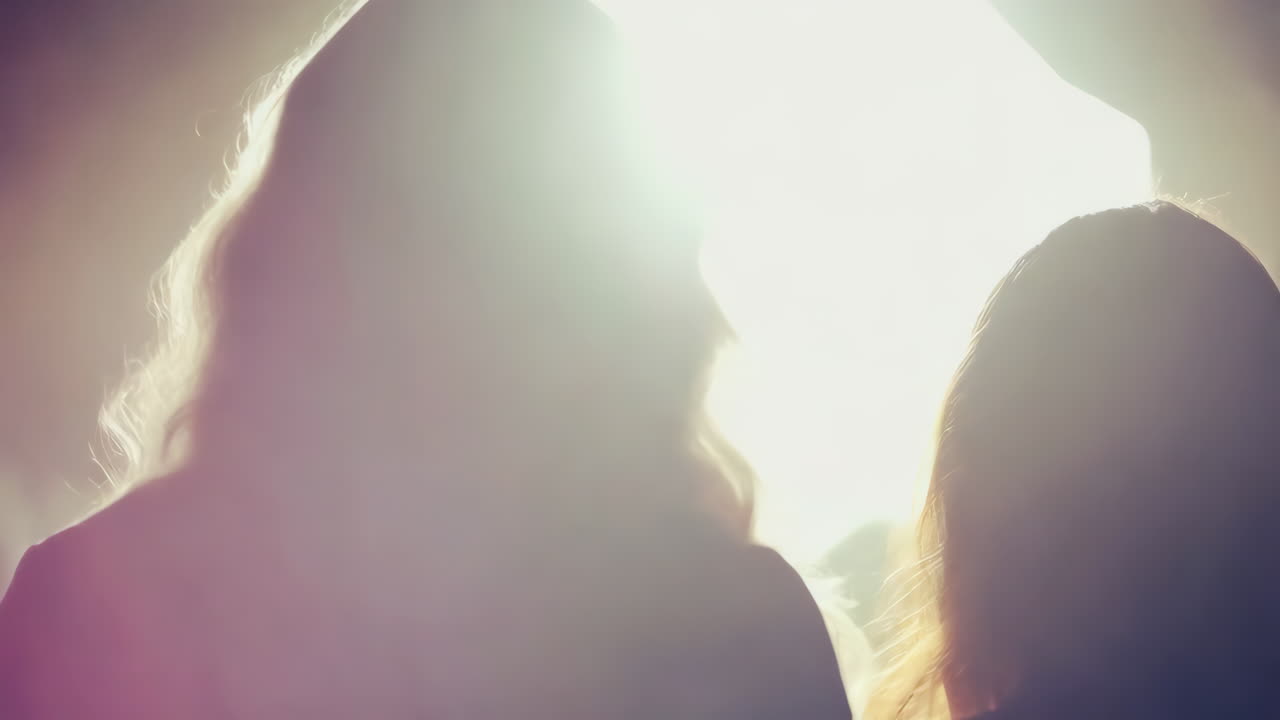 Silhouettes of women at an event