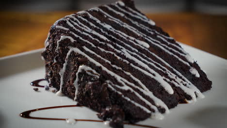 decadent triple layer chocolate cake drizzled with glaze on white plate, 4k