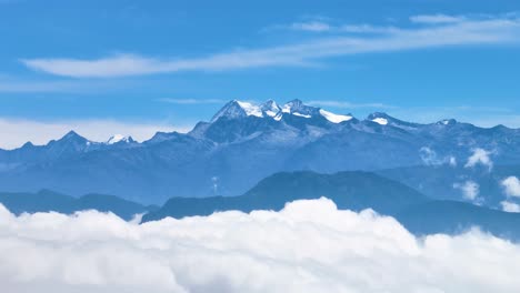 drone view of the snowy peaks of sierra nevada de santa marta in colombia, towering above the clouds, one of the highest coastal mountain ranges on earth