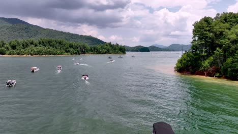 parade of boats on july 4th at watauga lake near elizabethton tennessee