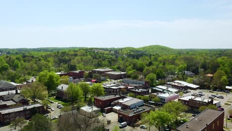 Drone-Pedestal-Up-of-Small-town-USA-Downtown-Hillsboro-North-Carolina-in-the-Summer