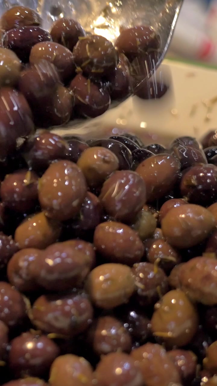 Bowl is full with marinated olives