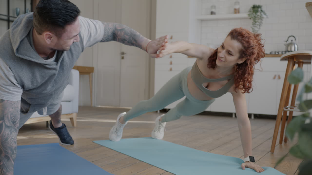 Couple Doing Push-Ups at Home