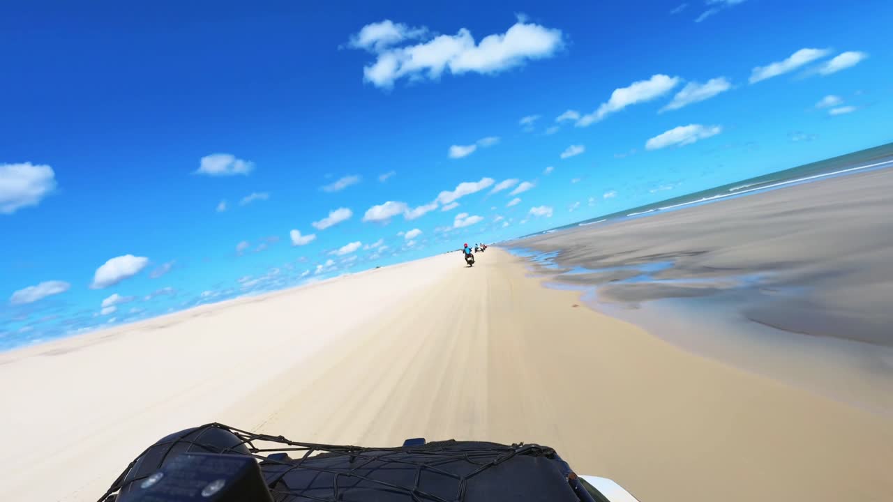 POV driving a quadricycle on Jericoacoara beach in ceara brazil