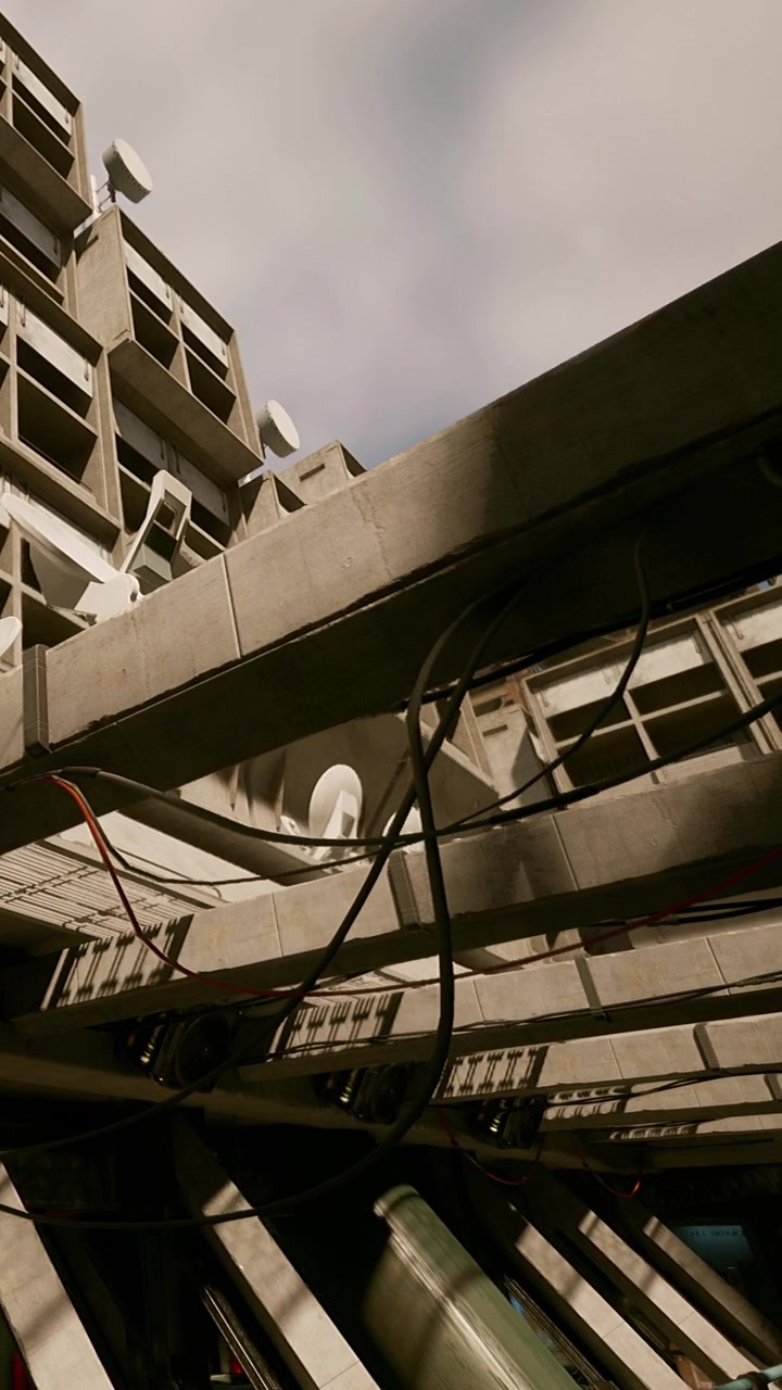 Construction site view of building with cables and structures in city landscape