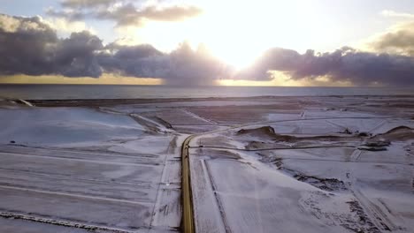 drone flies along famous route 1 iceland in a wonderful panorama sunset