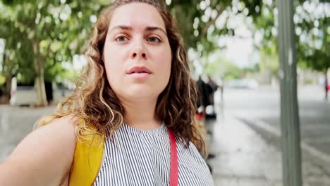 woman vlogging travel moments while exploring athens streets