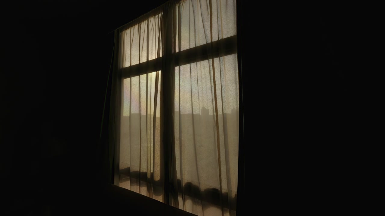 Sunrise light gradually brightens sheer curtains in a quiet Dubai hotel room