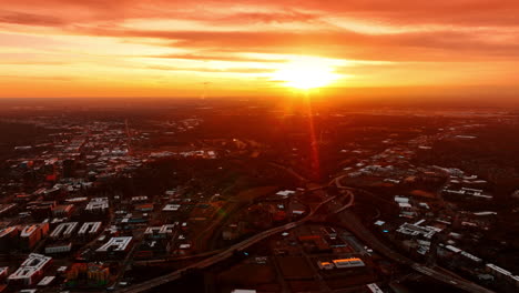 bright setting sun above the vast scenery of charlotte, north carolina, usa. colden hour in the city from top