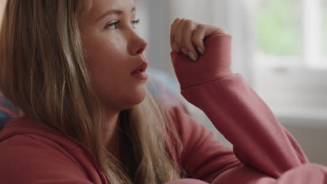 sad teenage girl alone at home feeling depressed moody teen thinking of emotional break up sitting in bedroom