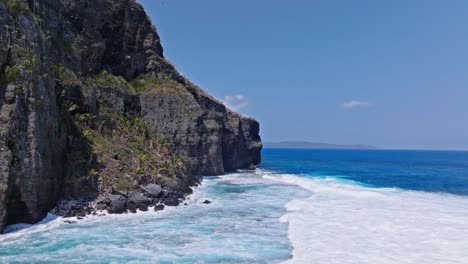 Drone-forward-shot-to-cliffs-at-Fronton-beach-in-Las-Galeras-Samana,-Dominian-Republic