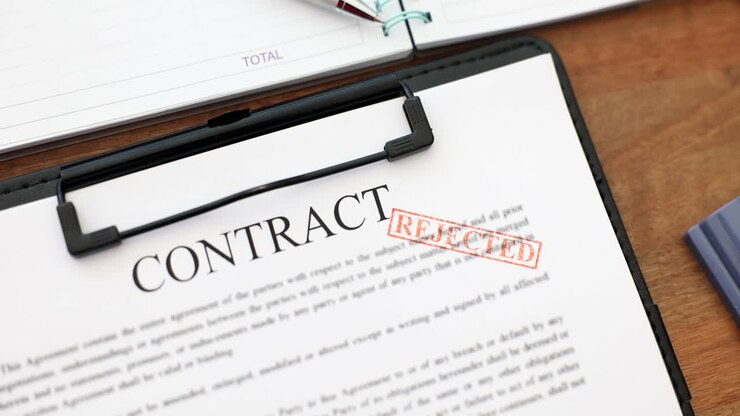 Rejected Contract Document on Desk