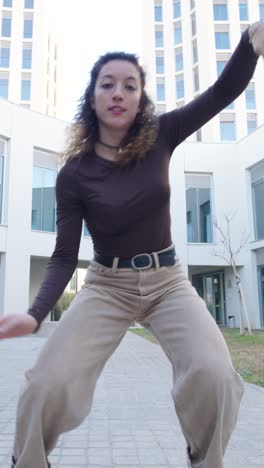 young energetic dancer performing modern choreography outdoors