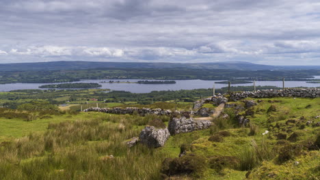 Time-lapse-of-rural-and-remote-landscape-of-grass,-trees-and-rocks-during-the-day-in-hills-of-Carrowkeel-in-county-Sligo,-Ireland