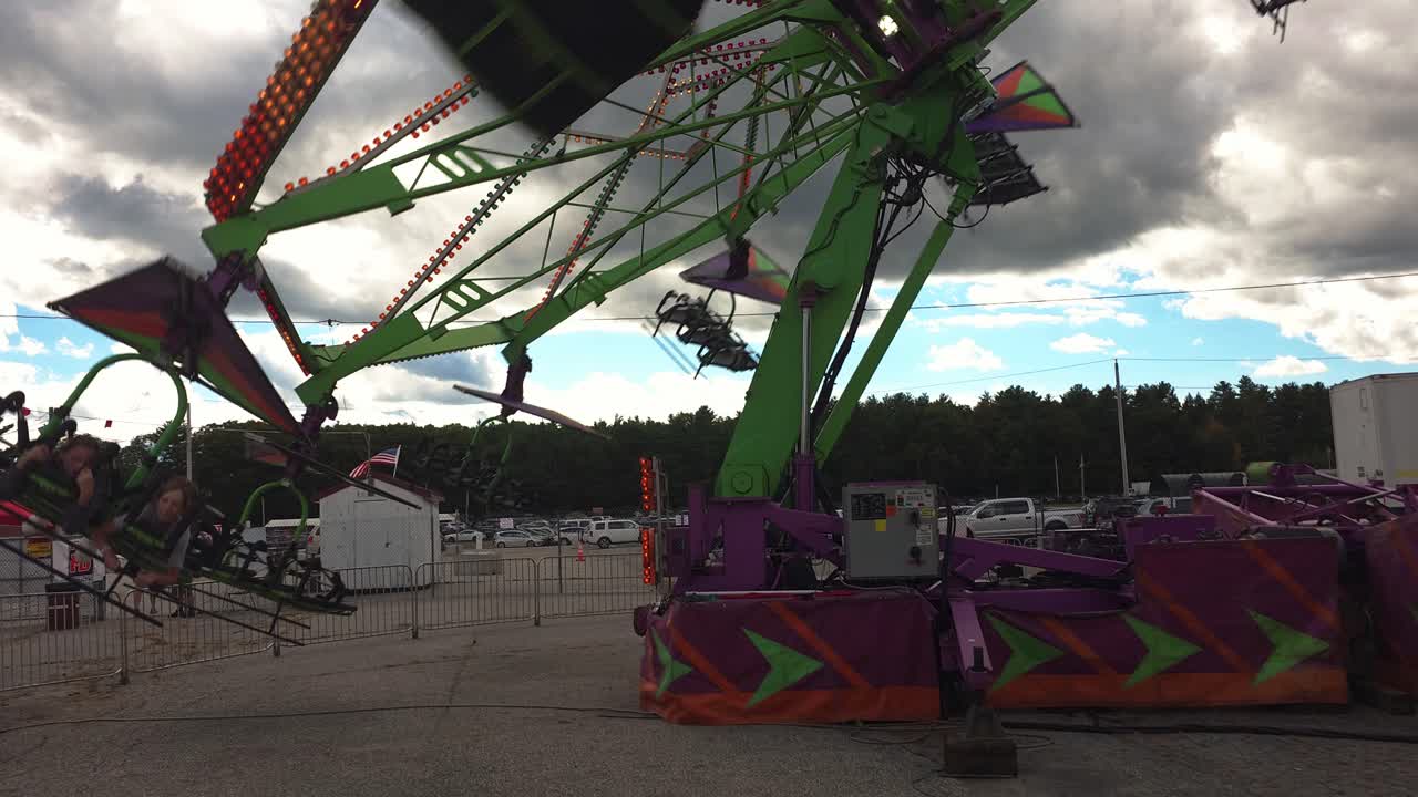 People riding a ride at the Cumberland Fair near Portland, Maine
