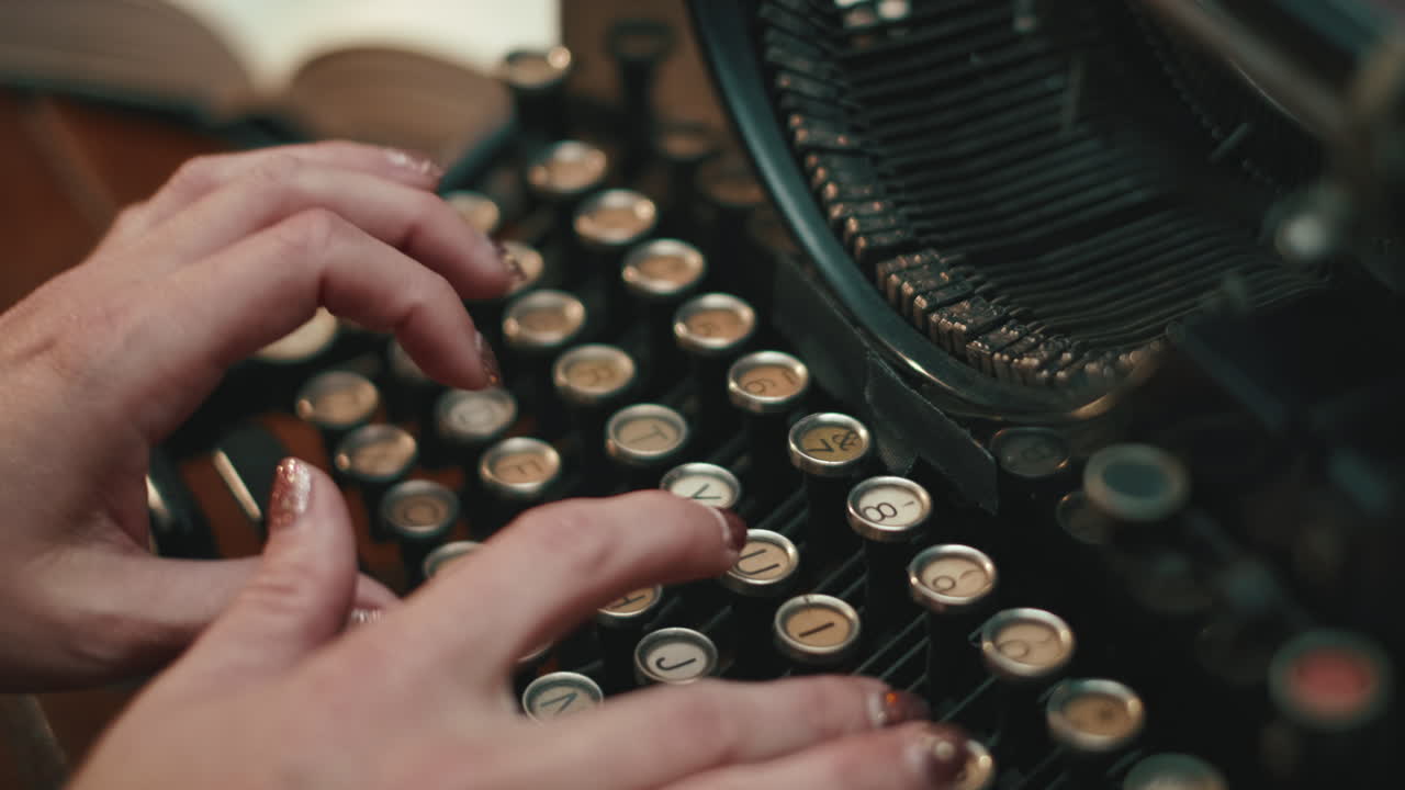 Woman typing on vintage typewriter