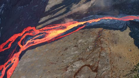 lava river flowing in the valley during eruption of fagradalsfjall volcano in reykjanes, iceland