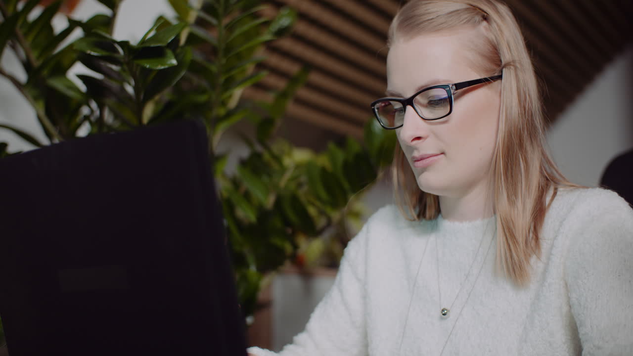 Attractive Woman Working On Laptop At Home Office 3