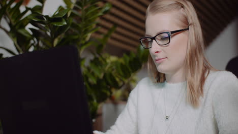 Attractive-Woman-Working-On-Laptop-At-Home-Office-3