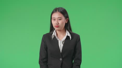 businesswoman in a black suit looking serious