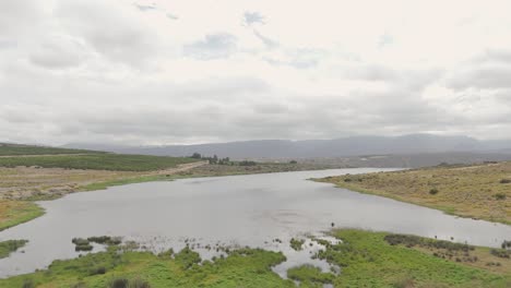 Aerial-view-of-the-dam,-showcasing-its-size-and-surroundings