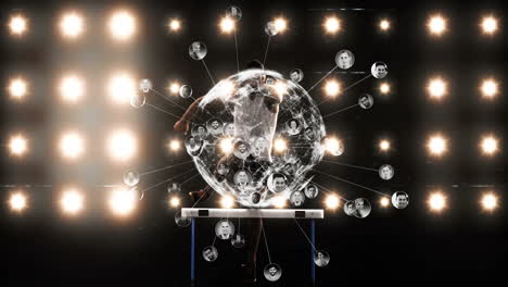 Animation of connected profiles glowing around central figure on dark stage