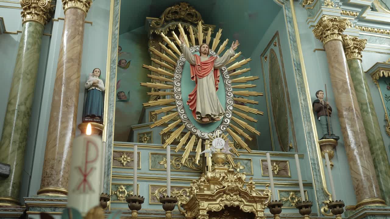 detailed altar with sacred heart statue and rich decorative elements