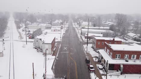 heavy snowstorm hit small iconic american township, aerial drone view