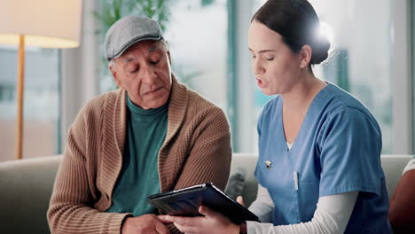 nurse assisting elderly patient with tablet