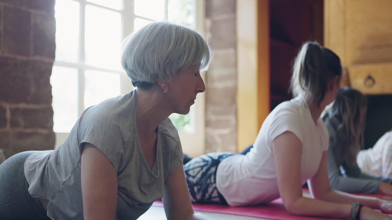 Yoga class with women exercising