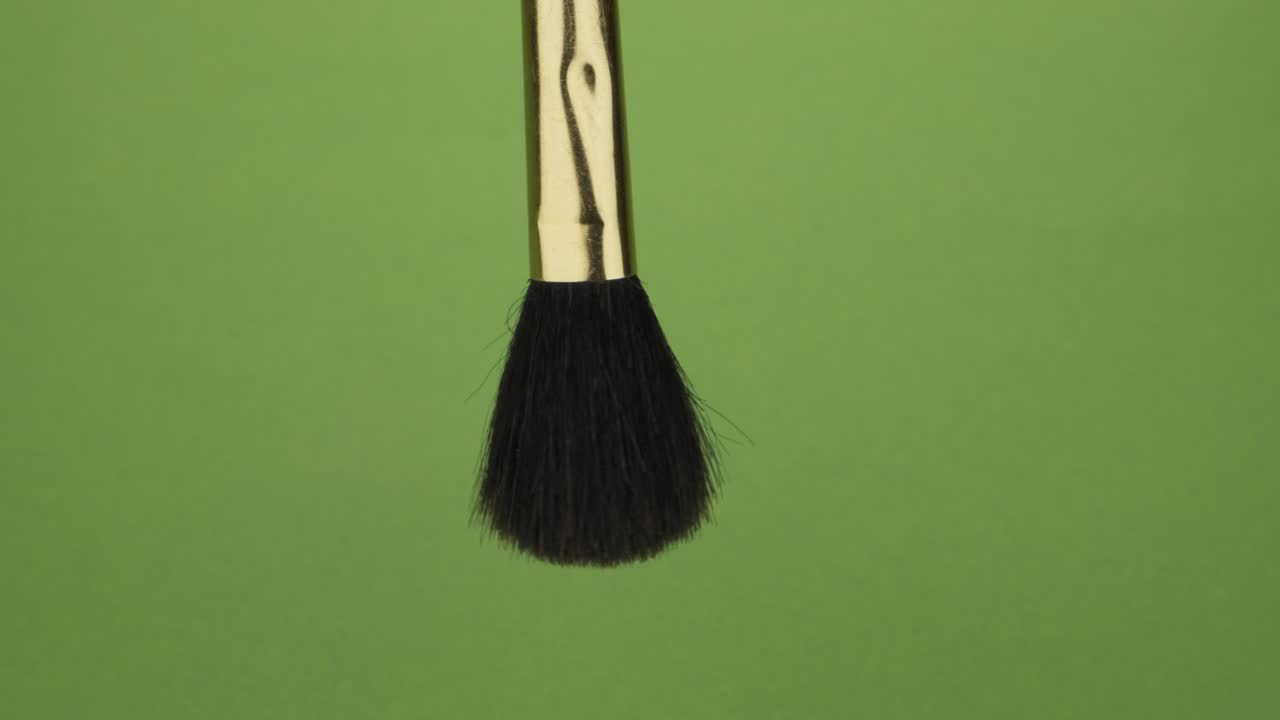 Rotation of a cosmetic brush on a green screen. Cosmetic brush