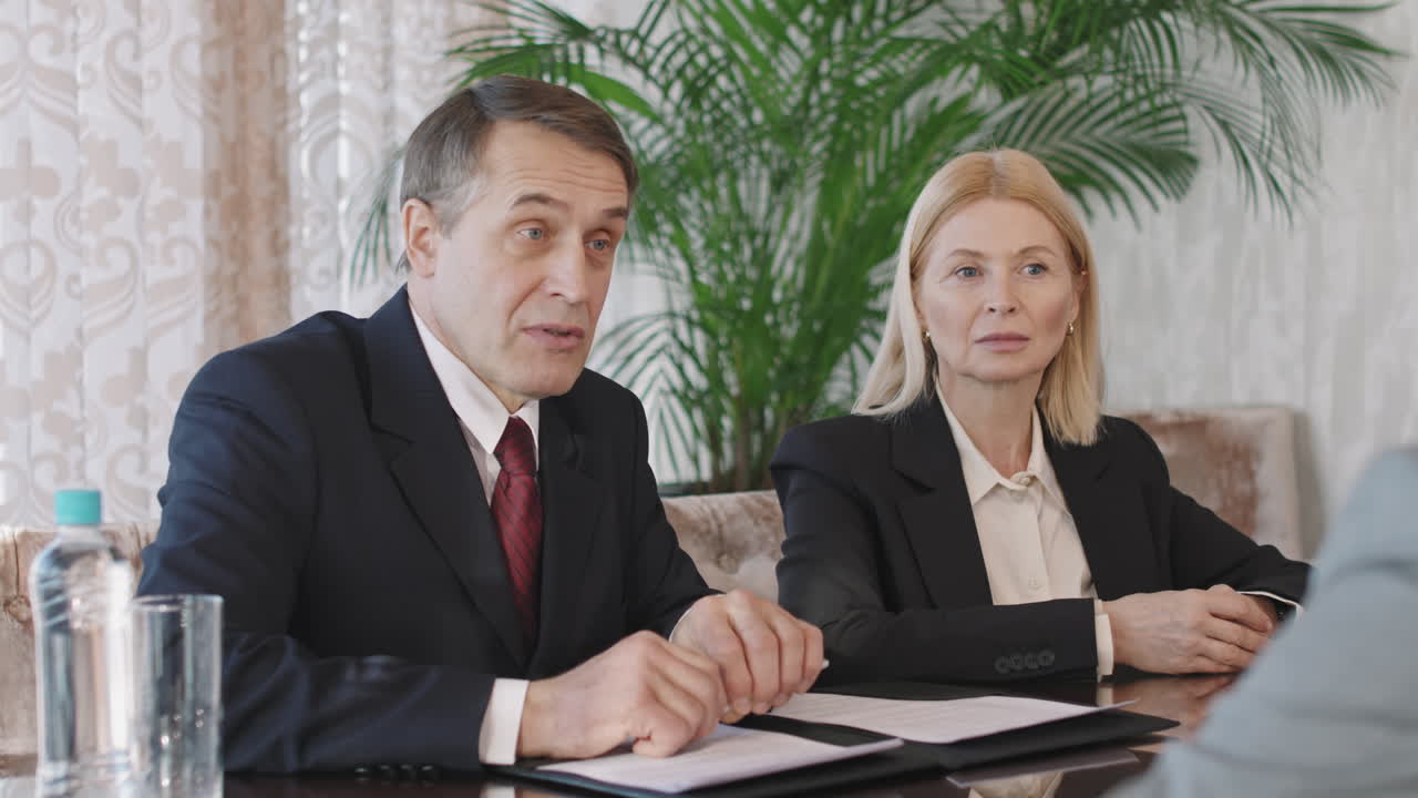 Investors Discussing Business In Conference Room