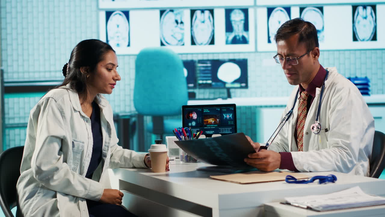 Doctor examining patient's x-ray