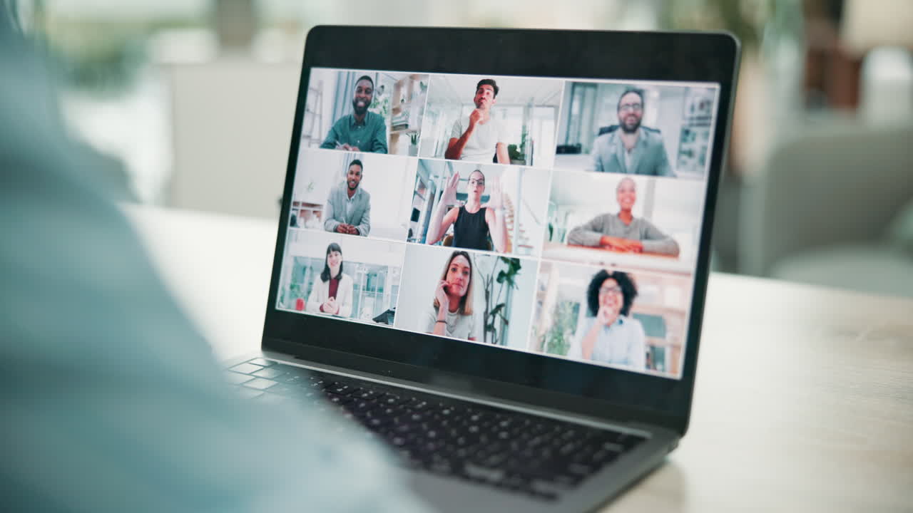 A video call on a laptop with multiple participants