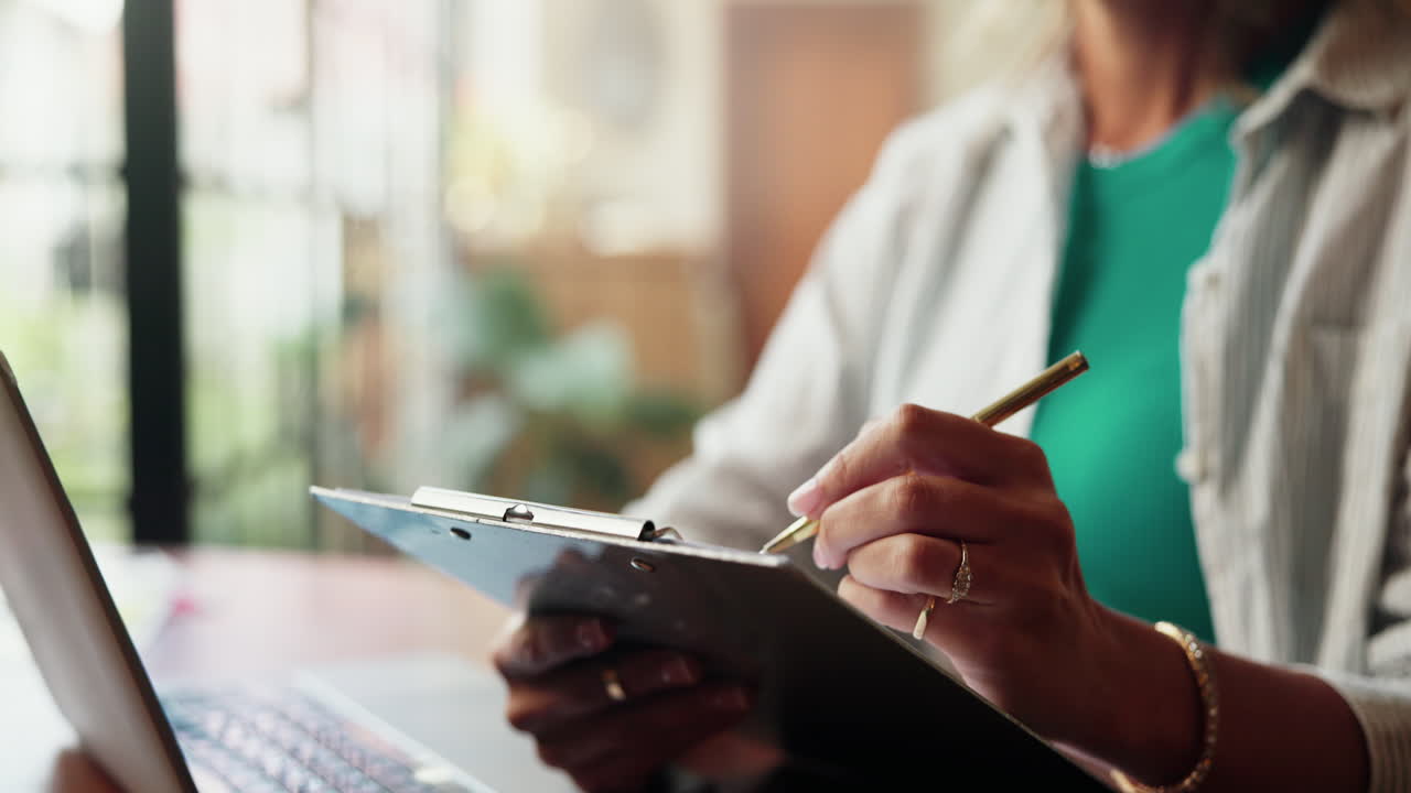 Close-up of Woman Writing Notes on a Clipboard