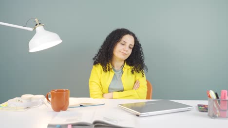 young woman closing laptop with angry expression.
