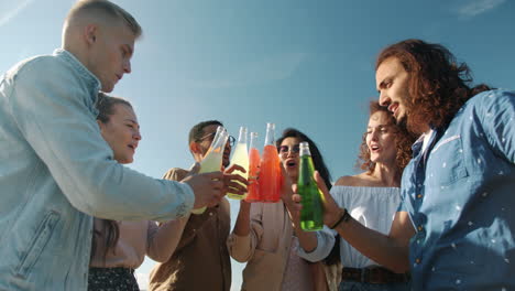 friends toasting with colorful drinks