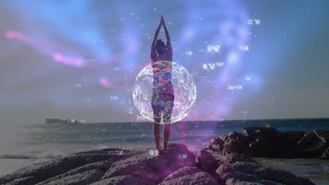 animation of globe and connections over back of biracial woman practicing yoga at sea