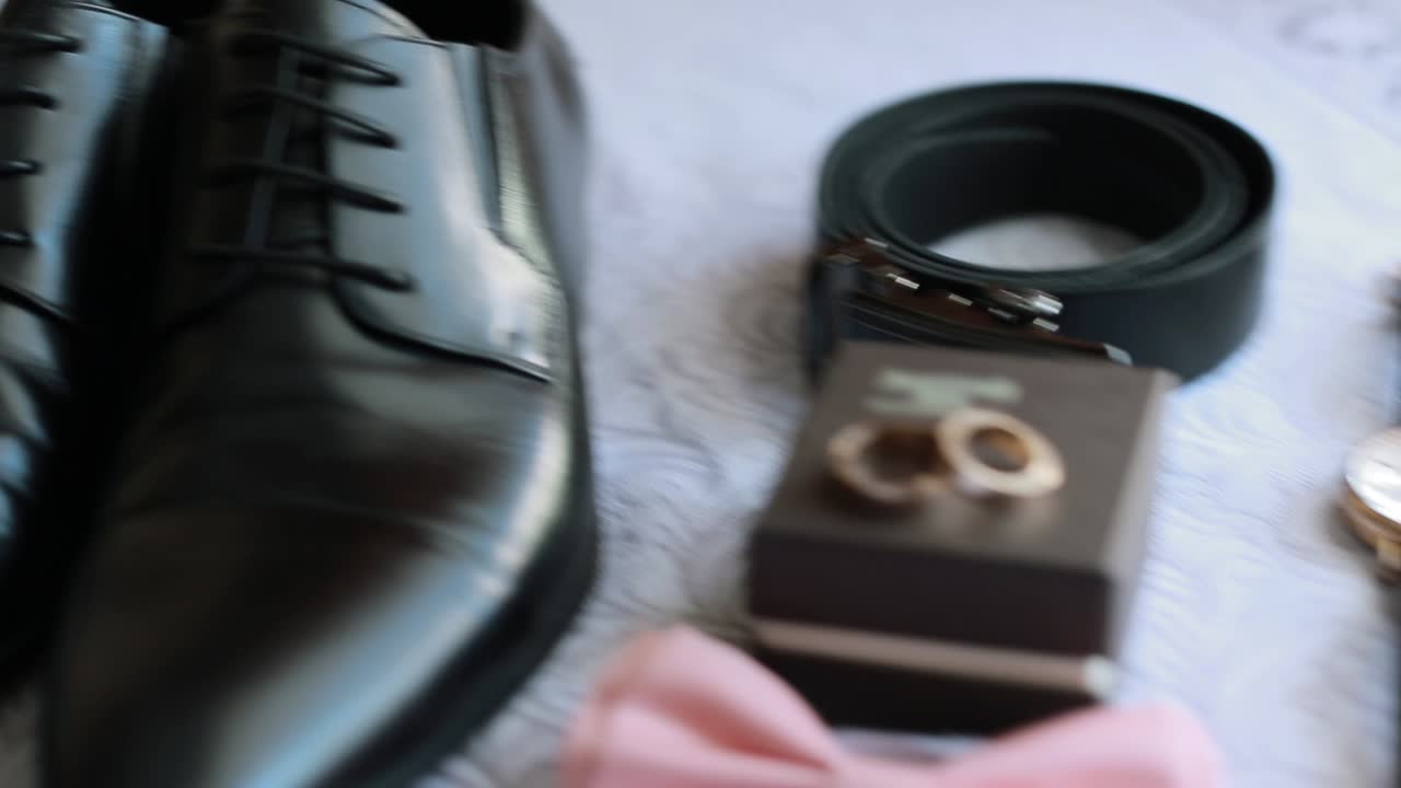 Accessories Groom Morning. Wedding details. Groom accessories. Shoes, rings belt and bowtie