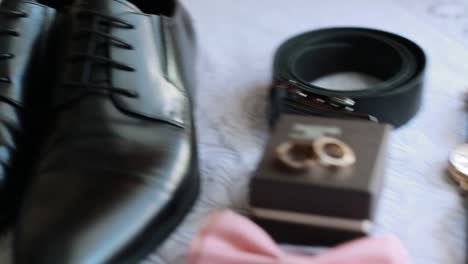accessories groom morning. wedding details. groom accessories. shoes, rings belt and bowtie