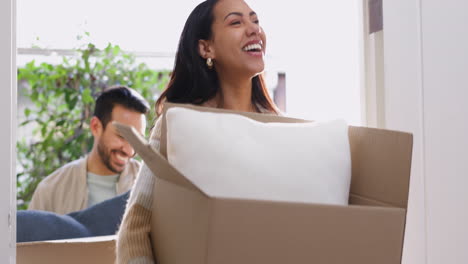 couple, moving and walking boxes up stairs in new