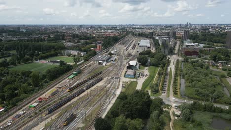 Aerial footage showing railway tracks and train maintenance area - Watergraafsmeer depot, Amsterdam