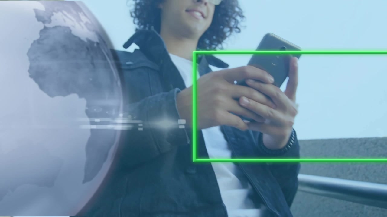 Animation of globe and neon frame over hands of man using smartphone