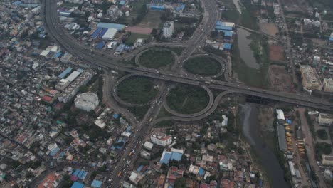 drone footage of cloverleaf flyover bridge located at india